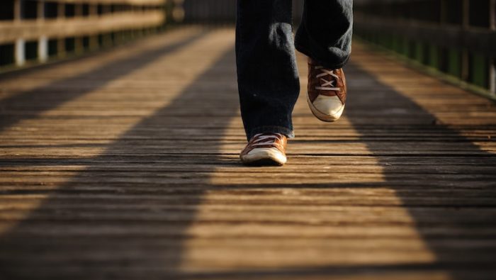 A photograph of someone walking