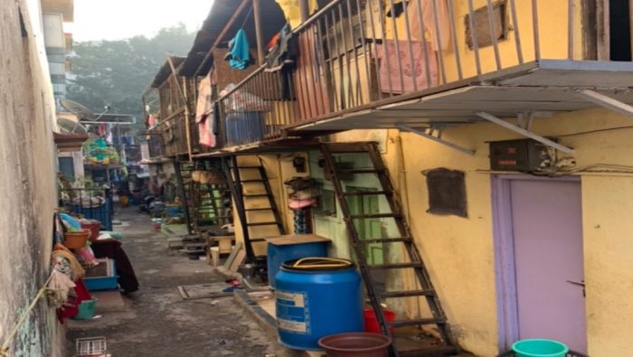 A photograph from Anwita Dinkar's fieldwork, showing houses along a street in India