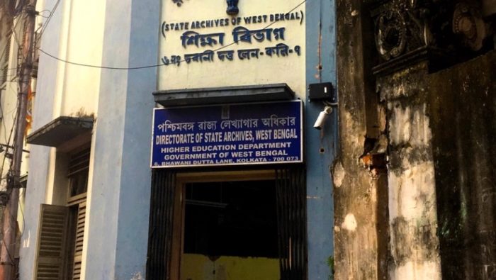 Entrance way to a building on Dutta Lane, Kolkata, India. The sign above the door reads the Directorate of State Archives, West Bengal.