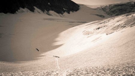 Persons walking a remote mountains