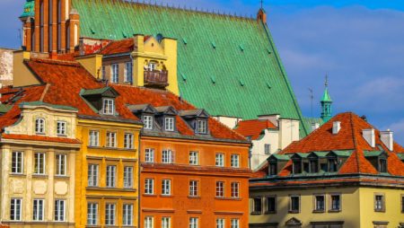 Bright, colourful buildings rise up in Warsaw's Old Town, Poland.