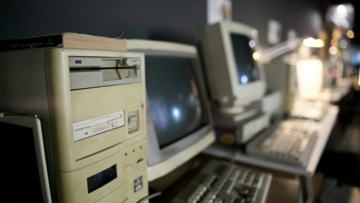 Old computer monitors. Unsplash image by Kimberly Nguyen