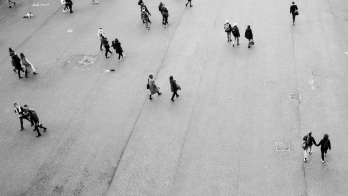 People walking on a square from the bird perspective